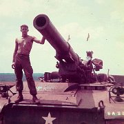 Gene Mikovilje on an 8 inch Gun