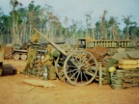 Crossed Cannons - The Ox Cart actually served as a shower. Note lister bag hanging from it. FSB Ft. Defiance early spring 1970.  RMcDonald Photo