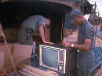 SSG John Speedy, battery supply sergeant, and CPT Gerald McElroy, BC, examining new TV for the Service Battery day Room