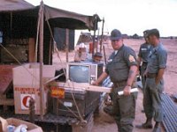 Service Battery 1SG Buddy Brogdon examining TV for the day room