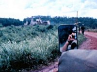 Approaching the one-lane old French bridge over the Song Be [River] on the road to Phuoc Vinh