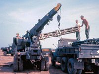 Borrowed ARVN wrecker unloading construction material
