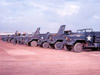 Service Battery trucks lined up in the motor pool