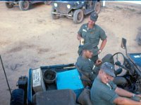 1LT Andreeko,  battalion ammunition officer, SP4 McKee, driver and 1LT Cecil Gardner, battalion motor officer, conferring before convoy to Phuoc Vinh