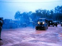 The air blue with diesel fumes, a convoy heads out at dawn from Long Binh to Phuoc Vinh