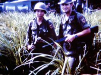 1LT Melvin Jones (right), Assistant Senior Adviser, ARVN 35th Bn, with one of the Rangers.  Copyright 2014 Melvin Jones, John Girardeau &#38; www.quanloi.org