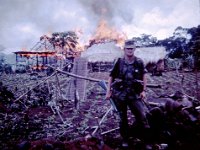 1LT Jones near burning VC/NVA village.  Copyright 2014 Melvin Jones, John Girardeau &#38; www.quanloi.org