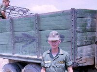 John Girardeau in front of a captured VC truck.