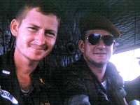 John Girardeau and an adviser on a helicopter returning from an operation with the ARVN Rangers.  Note the beginnings of a beard!
